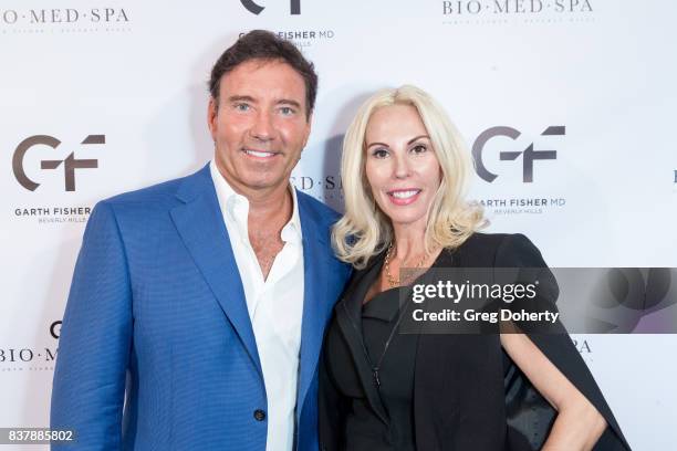 Dr. Garth Fisher and Valerie Norgard attends the Official Launch Party Of Dr. Garth Fisher's BioMed Spa at Garth Fisher MD on August 22, 2017 in...