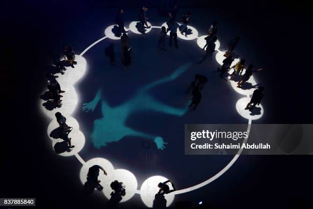 Visitors interact with light projections entitled 'Flock' by UK artists Tom Wexler and Kit Monkman during the Singapore Night Festival media preview...
