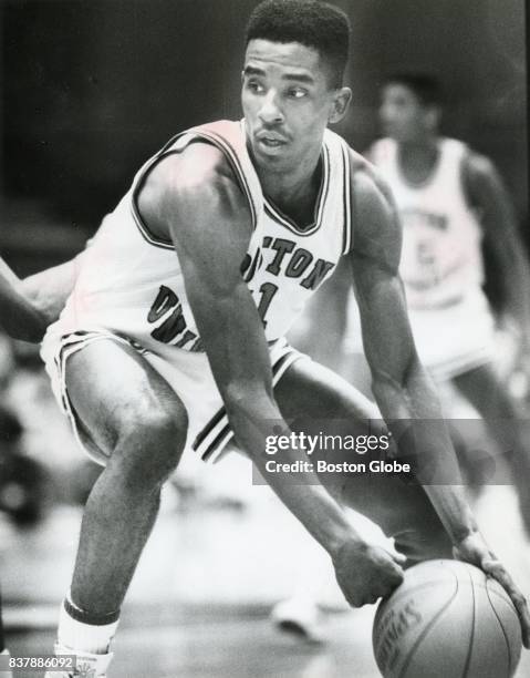 Boston University's Drederick Irving looks to pass the ball against University of Vermont during a game in Boston, Jan. 30, 1988.