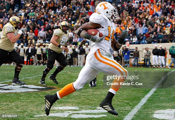 Eric Berry of the Tennessee Volunteers returns an interception for a touchdown against the Vanderbilt Commodores during the game at Vanderbilt...