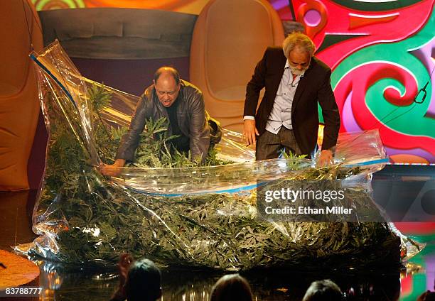 Cheech Marin and Tommy Chong emerge from a prop bag of marijuana as they arrive for their roast at The Comedy Festival at Caesars Palace November 21,...