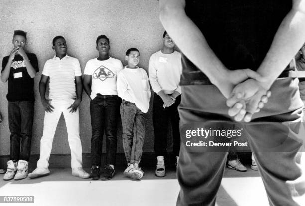 Some of the eight teenagers from Northeast Denver listens to a convict from the Arkansas Valley Prison near ***** way Colo. During a prison tour...