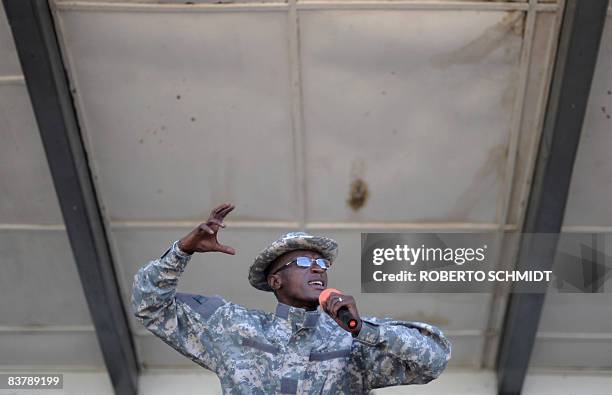 Rebel leader Laurent Nkunda speaks to a crowd at the local stadium in the North Kivu town of Rutshuru on November 22, 2008. About 500 people packed...