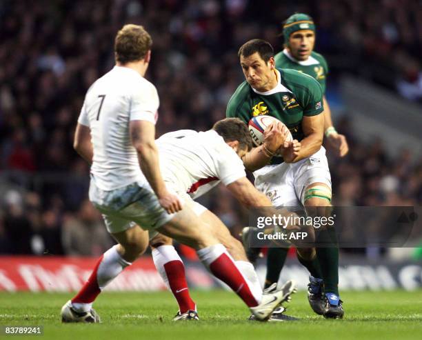 South Africa's Pierre Spies is tackled by England's Nick Easter and Tom Rees during the Investec Challenge international rugby match at Twickenham,...