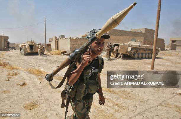 Fighter from the Hashed Al-Shaabi carries his RPG inside al-Nour neighbourhood, in eastern Tal Afar, the main remaining stronghold of the Islamic...