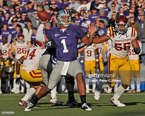 Quarterback Josh Freeman of the Kansas State Wildcats throws the ball down field under pressure from defensive end Christopher Lyle of the Iowa State...