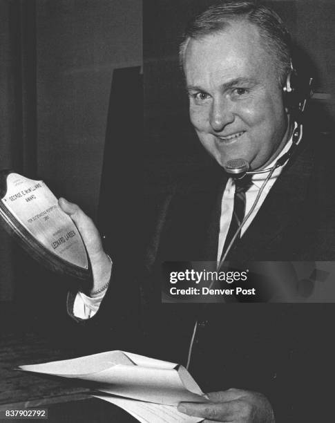 Larsen Wins Guild Award Leonard Larsen, Denver Post staff writer, holds George E. McWilliams Award plaque which he was awarded at the annual Gridiron...