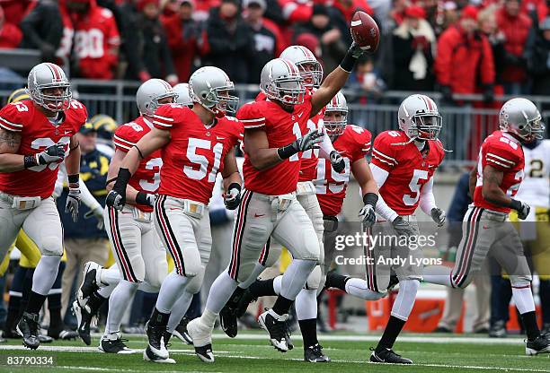 Marcus Freeman of the Ohio State Buckeyes celebraes recovering a Michigan Wolverines fumble during the Big Ten Conference game at Ohio Stadium on...
