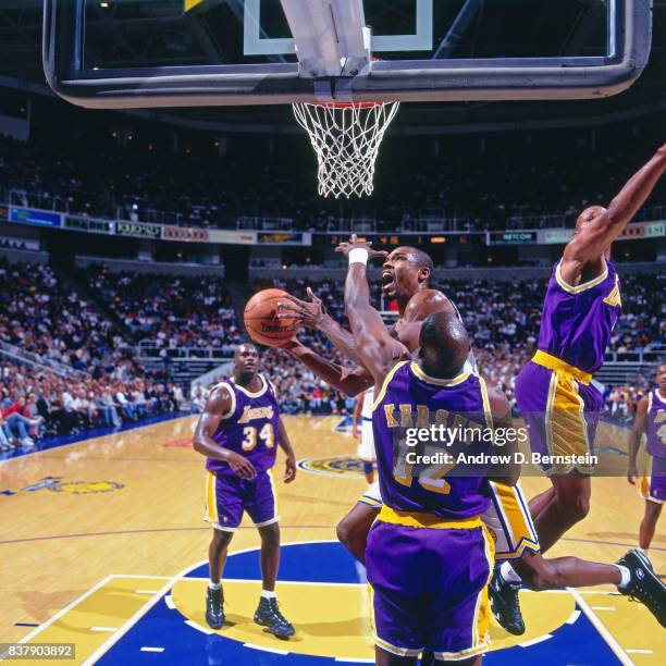 Latrell Sprewell of the Golden State Warriors shoots against the Los Angeles Lakers on November 19, 1996 at the Arena in Oakland in Oakland,...