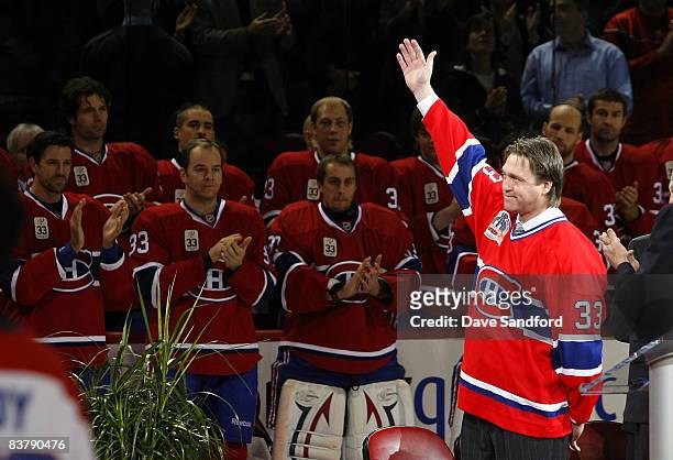 Patrick Roy waves to the crowd during a ceremony to retire his before the Boston Bruins face the Montreal Canadiens during their NHL game at the Bell...