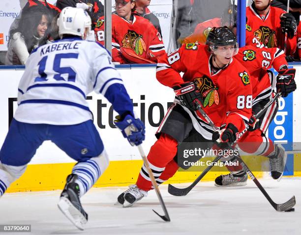 Tomas Kaberle of the Toronto Maple Leafs defends against Patrick Kane of the Chicago Blackhawks during game action November 22, 2008 at the Air...