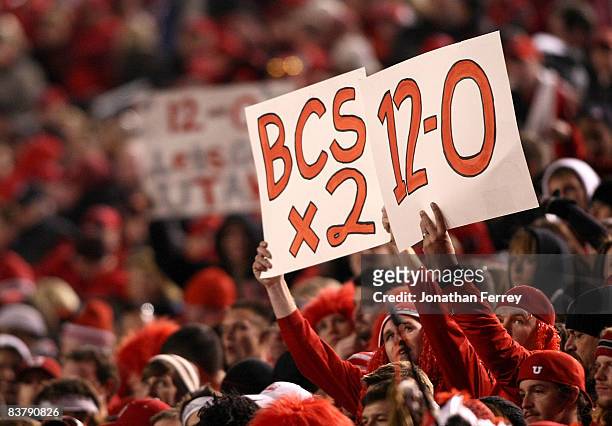 Fan of the Utah Utes holds a a sign after defeating the BYU Cougars 48-24 to complete a pefect 12-0 season at Rice-Eccles Stadium on November 22,...