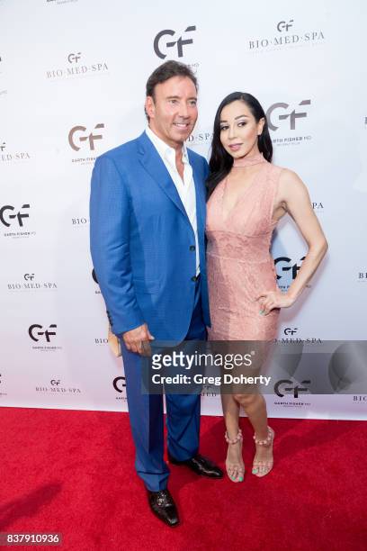 Dr. Garth Fisher and guest attend the Official Launch Party Of Dr. Garth Fisher's BioMed Spa at Garth Fisher MD on August 22, 2017 in Beverly Hills,...