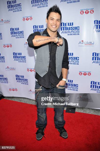 Actor Michael Copon shows off a tattoo on his arm of Albert Einstein's quote: "Imagination is more important than knowledge" at the New Music Weekly...