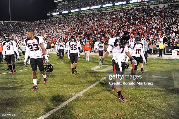 Safety Darcel McBath and the Texas Tech Red Raiders walk off the field after a 65-21 loss against the Oklahoma Sooners at Memorial Stadium on...