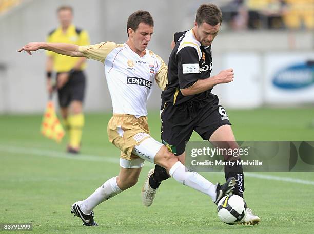 Tim Brown of the Phoenix is tackled by Benjamin Kantarovski of the Jets during the round 12 A-League match between the Wellington Phoenix and the...