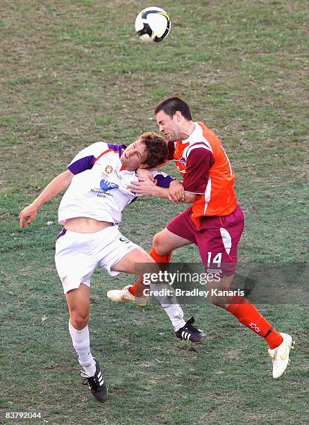 Ben Griffin of the Roar and Anthony Skoric of the Glory compete for the ball during the round nine National Youth League match between Queensland...