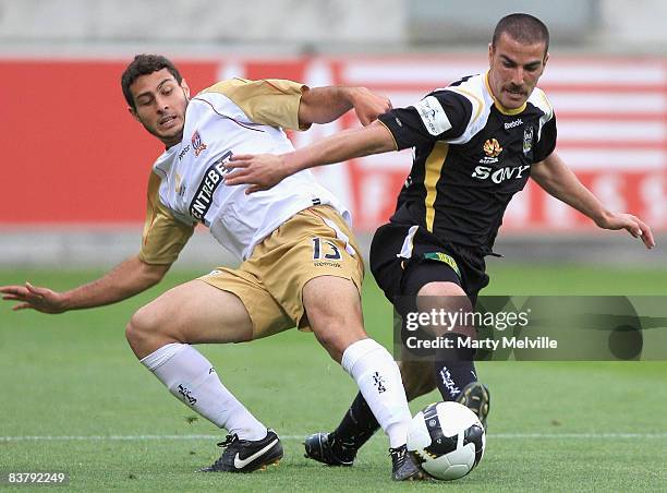 Emmanuel Muscat of the Phoenix is tackled by Adam D'Apuzzo of the Jets during the round 12 A-League match between the Wellington Phoenix and the...