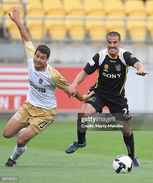 Emmanuel Muscat of the Phoenix is tackled by Adam D'Apuzzo of the Jets during the round 12 A-League match between the Wellington Phoenix and the...