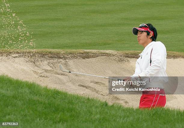 Ryo Ishikawa of Japan plays a bunker shot on the 13th hole during the final round of the Dunlop Phoenix Tournament 2008 at Phoenix Country Club on...