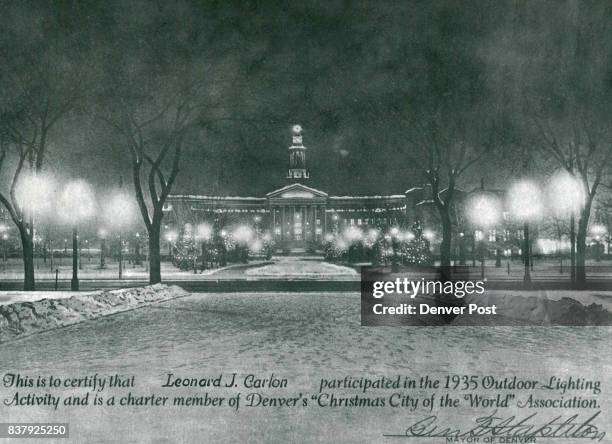 This is how first Christmas lights on Denver City Hall looked in 1935 Certificate was presented to Leonard J. Carlon, one of the original volunteers....