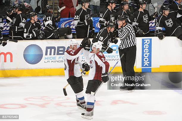 Paul Stastny and Milan Hejduk of the Colorado Avalanche celebrate a 4-3 win in a shootout against the Los Angeles Kings during the game on November...