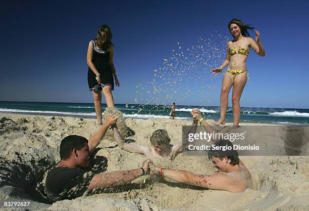 Group of graduating school leavers play on the beach ahead of the nights Schoolies celebrations in Surfers Paradise on November 23, 2008 on the Gold...