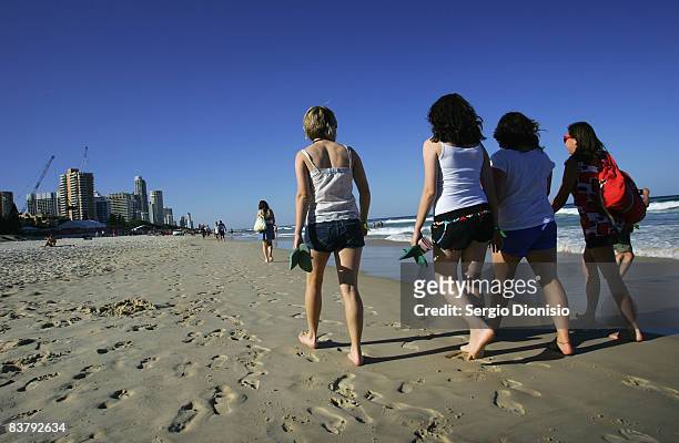 Group of graduating school leavers walk along the beach towards Surfers Paradise for the nights Schoolies celebrations on November 23, 2008 on the...