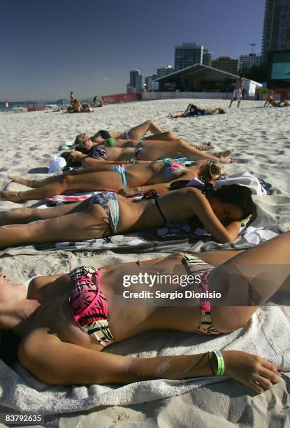 Group of graduating school leavers sunbath on the beach ahead of the nights Schoolies celebrations in Surfers Paradise on November 23, 2008 on the...