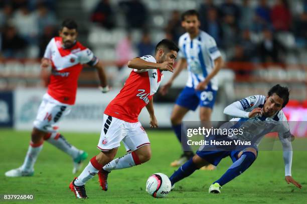 Daniel Villalva of Veracruz struggles for the ball with Jorge Hernandez of Pachuca during the sixth round match between Pachuca and Veracruz as part...