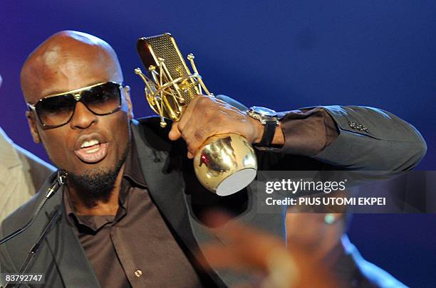 Nigeria's Ikechukwu speaks after collecting his award for best video "Wind Am Well" during the MTV Awards ceremony at the Veldrome in Abuja on...