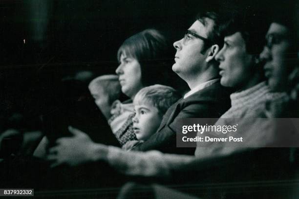 Crowd To Auditorium Theatre vided the instrumentalists for the presentation. At the right, Conrad Coffey a young member of the audience, appears to...