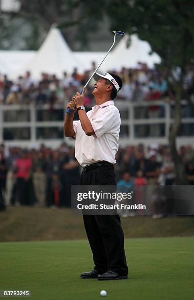 Lin Wen-Tang of Chinese Taipie reacts to a putt on the 18th hole during the final round of the UBS Hong Kong Open at the Hong Kong Golf Club on...