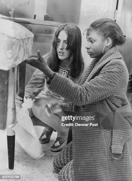 Beginning And Finished Chairs In Upholstery Calss Mrs. Vicki Albert, left, home economics teacher, and Mrs. Pat Ryan, right, math teacher, talk with...