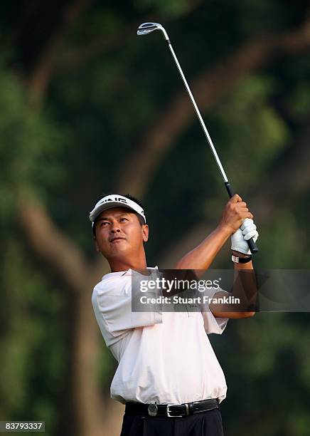 Lin Wen-Tang of Chinese Taipei plays his approach shot on the 14th hole during the final round of the UBS Hong Kong Open at the Hong Kong Golf Club...