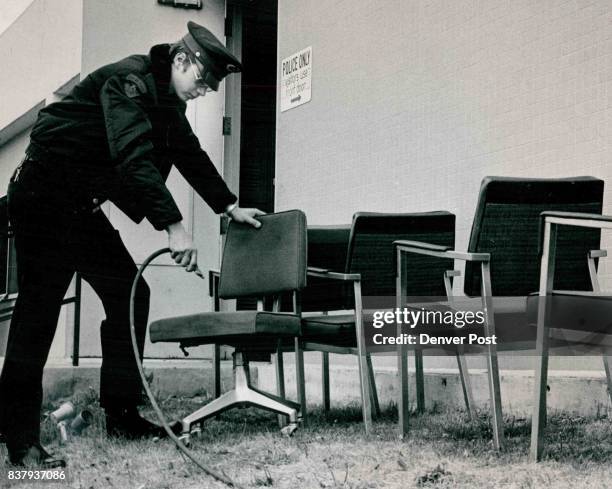 Police-Station Accident Was A Real Gasser Police Cadet Steve Tokorski uses air pressure to clean the powder residue of CS tear gas from furniture at...