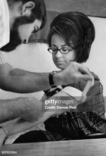 Anthony Keyser, a chemist at Colorado General Hospital ^ in Denver, takes a blood sample from Mrs. Fiodell Dubowitz, 1250 S. Monaco St. Parkway, as...