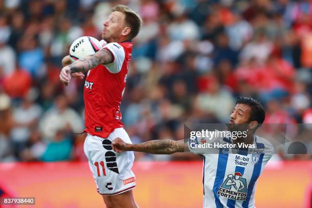 Cristian Menendez of Veracruz struggles for the ball with Robert Herrera of Pachuca during the sixth round match between Pachuca and Veracruz as part...