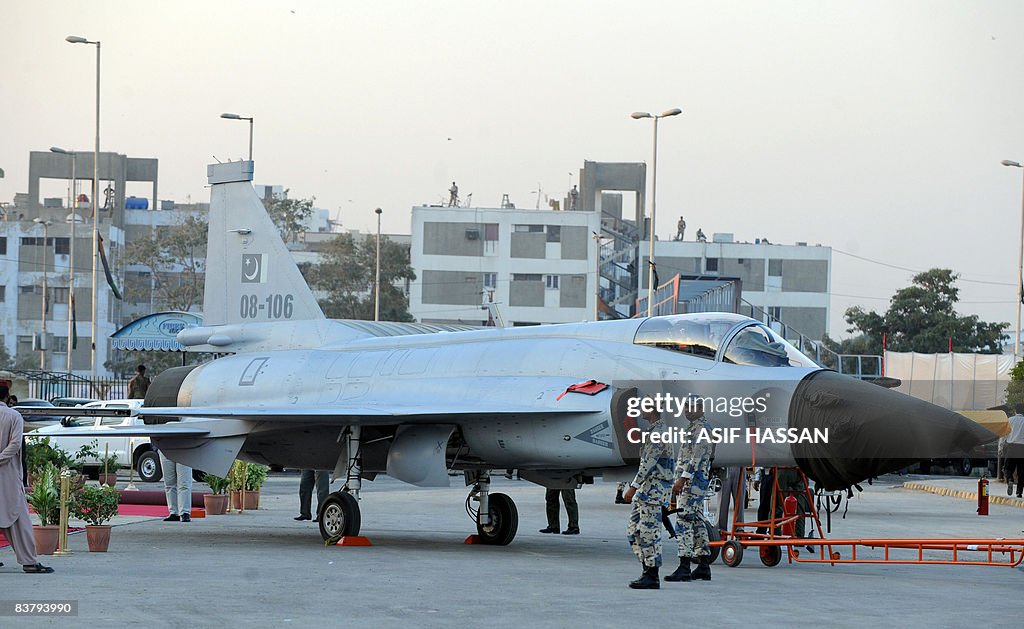 Pakistani airforce personals stand near