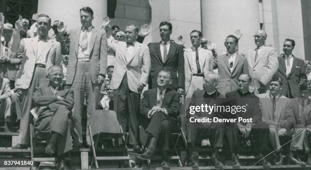 Eight of Denver's city council members stand on steps of city hall to take their oaths of office. From left are C. Paul Harrington George Cavender,...