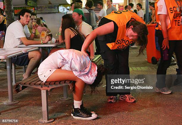 Schoolies support team member check on a young school leaver during the Schoolies week celebrations in Surfers Paradise on November 21, 2008 on the...