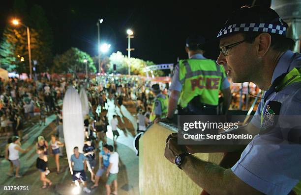 Police officers watch over the Schoolies week celebrations in Surfers Paradise on November 23, 2008 on the Gold Coast, Australia. Schoolies is the...