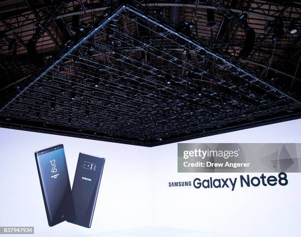 Samsung branding is projected on a screen during a launch event for the new Samsung Galaxy Note8 smartphone, August 23, 2017 in New York City. The...