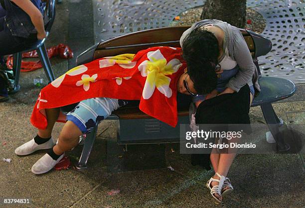 Young graduating year 12 school leavers sleeps on a park bench during the Schoolies week celebrations in Surfers Paradise on November 23, 2008 on the...