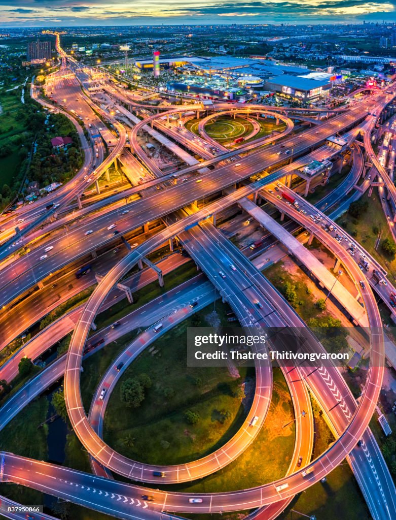 Aerial view of a Unique City Roads and Interchanges, Bangkok Expressway top view, Top view over the highway, expressway and motorway at night Aerial view from drone