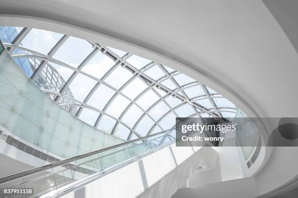 modern escalator - shopping centre escalator stock pictures, royalty-free photos & images