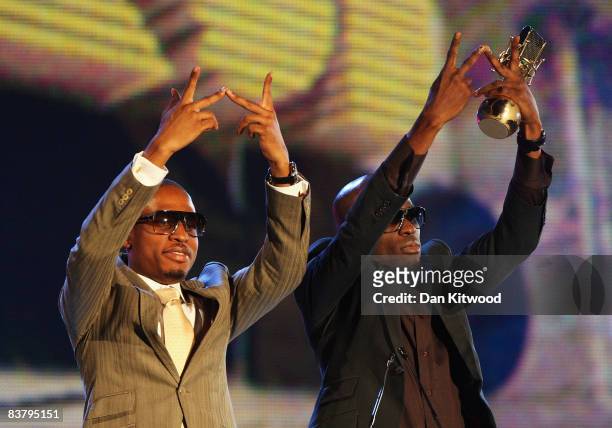 Naeto C celebrates with Ikechukwu as he accepts his award for Best Video on stage at the MTV Africa Music Awards 2008 at the Abuja Velodrome on...