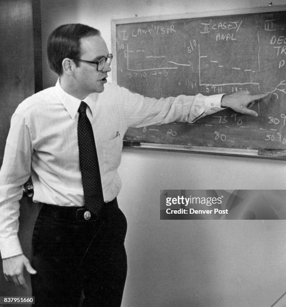 Law Professor John Soma Uses His Blackboard To Illustrate His Project Computer system would assist lawyers in predicting beforehand the likely...