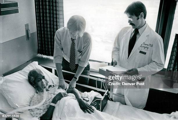 Evaluating The Nutritional Status of A Trauma Patient Nurse Todd Jones, top, checks nutritional status of patient Dorothy Byrd by measuring skin-fold...