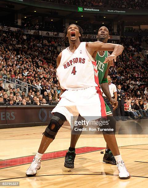 Chris Bosh of the Toronto Raptors fights for position under the net with Kevin Garnett of the Boston Celtics on November 23, 2008 at the Air Canada...